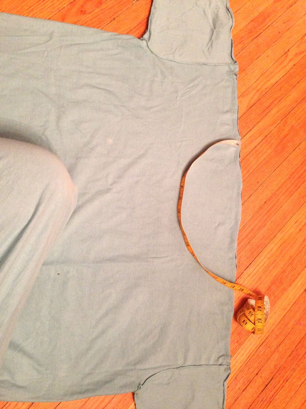 Use this measurement to rough out a curve on the raw edge of your larger T. Mark the beginning, and the depth of the curve, making sure it is centered between the sleeve seams.