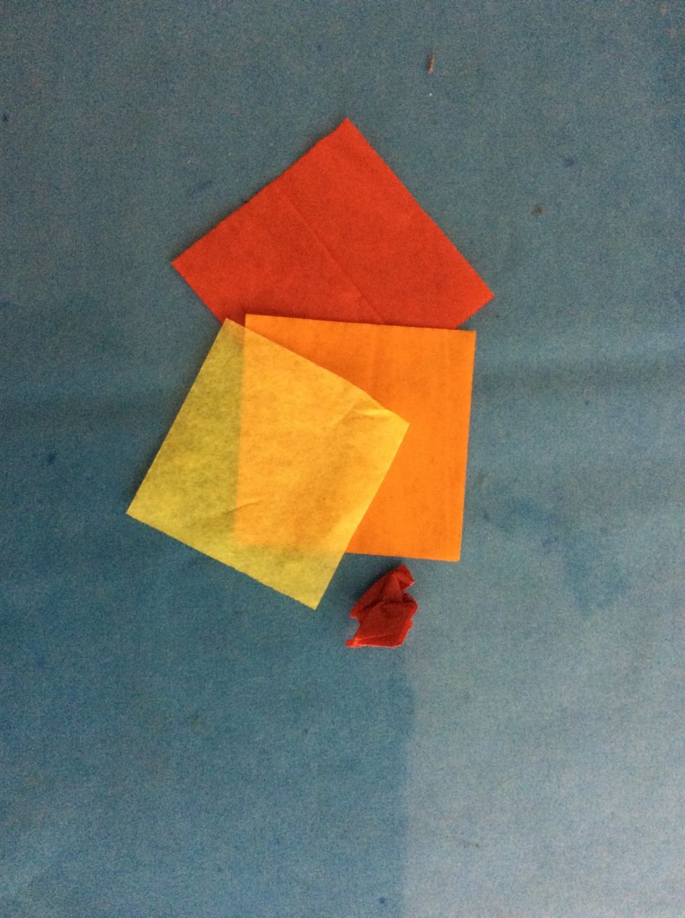 Use tissue paper to make marigold centers. Crumple the tissue. Glue.