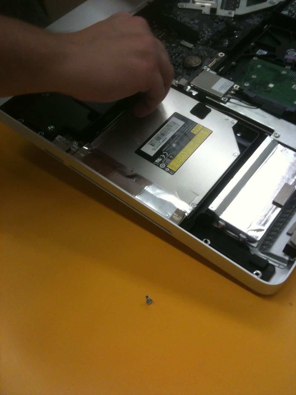 Use torx tools and phillips tools on the CD/DVD slot!
