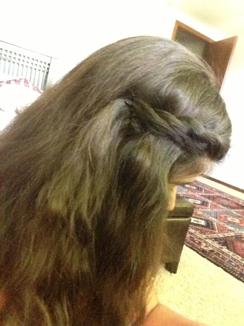 Use two bobby pins to keep the hair in place.
