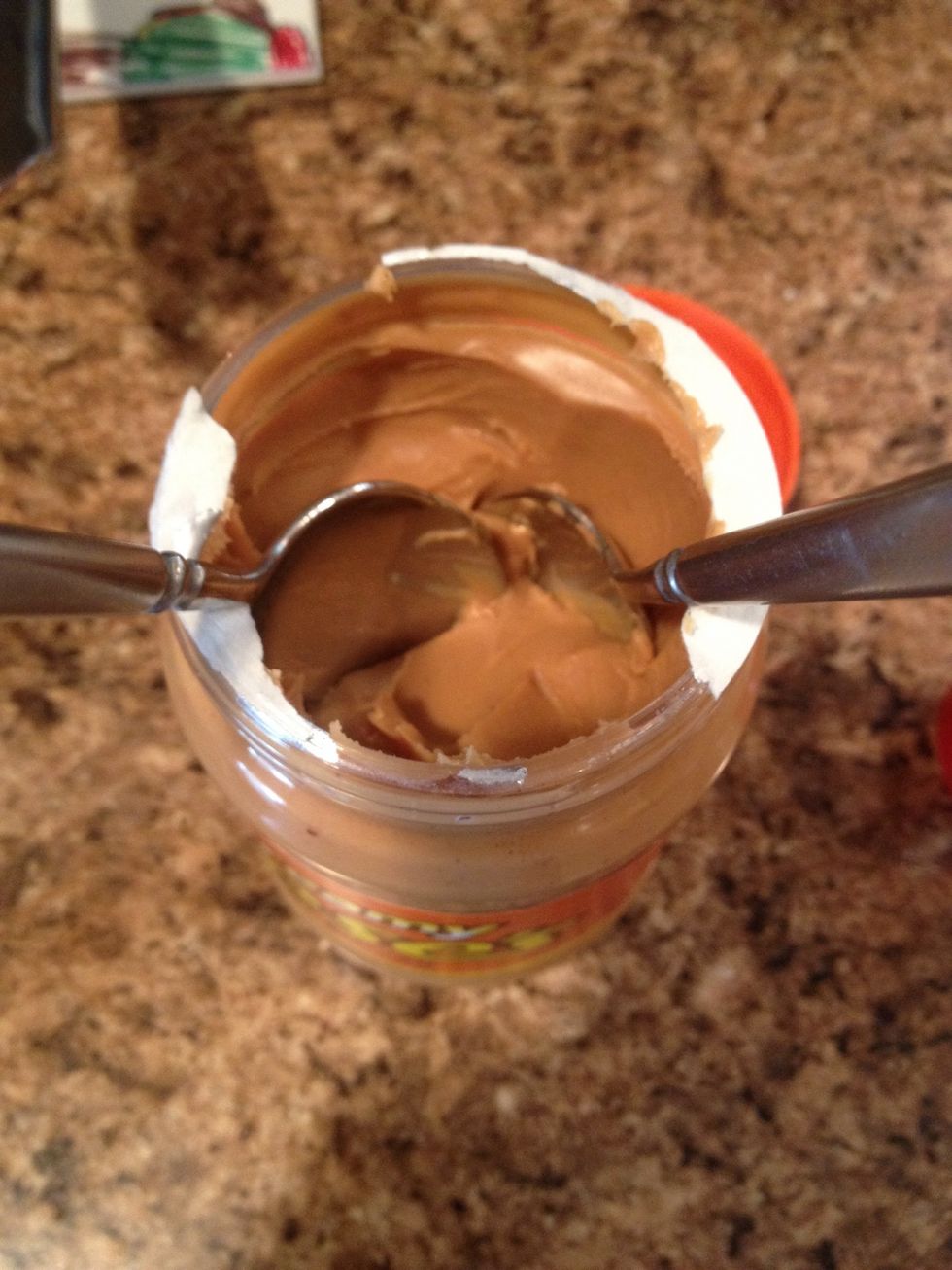 Use two spoons to add peanut butter