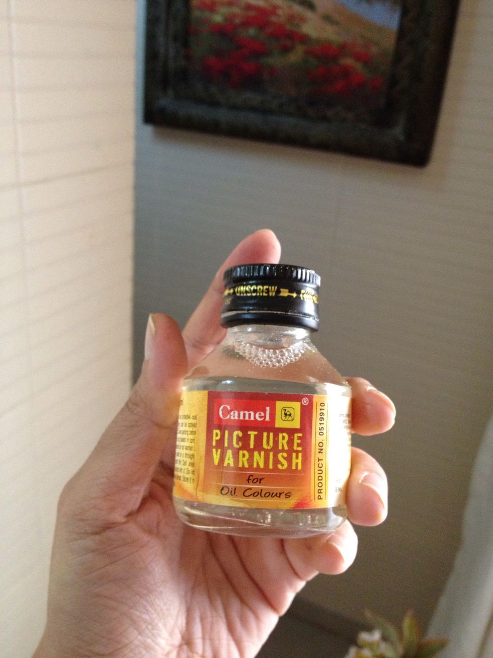 Use varnish on top as a top coat. It will give your frame a glossy effect at the same time protect the paint.