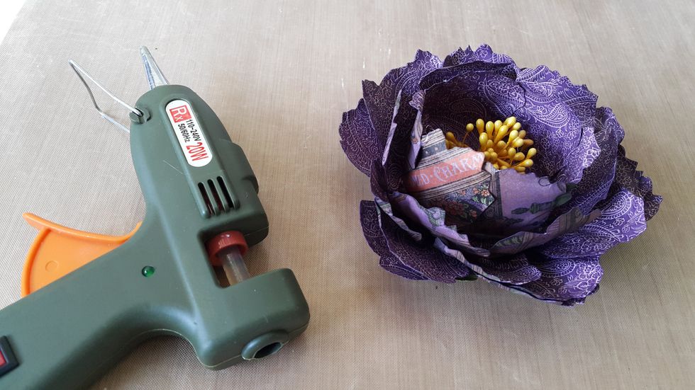 Use whatever kind of strong adhesive to stick the panels and the flower stamen, I\u2019d use hot glue gun here