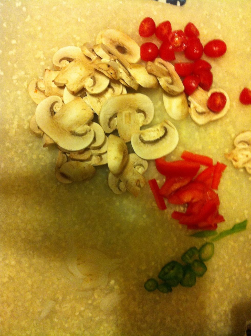 Use whatever vegetables you prefer on your pizza. For me I like onion, bell pepper, green pepper, mushrooms, & baby tomatoes