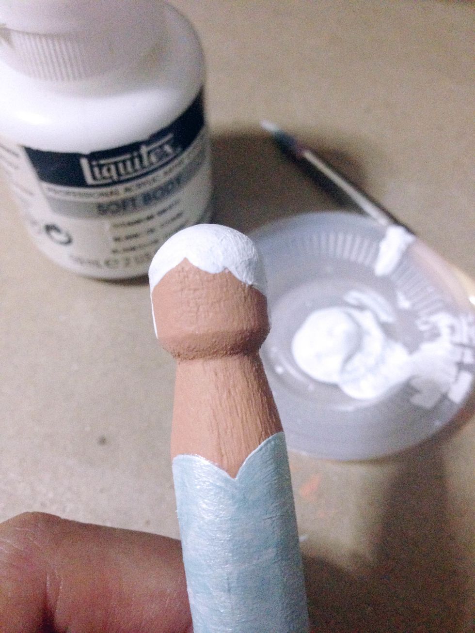 Use white acrylic paint, paint the hair on the head of the peg... Feel free to create any hairstyle for your fairies...