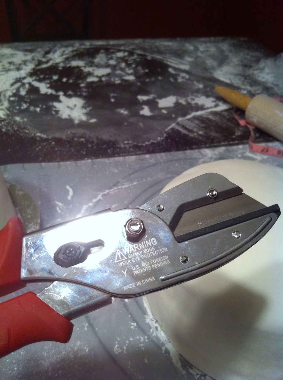 Use wire cutters to cut the dowels to insert into the cake. This supports the tiers.