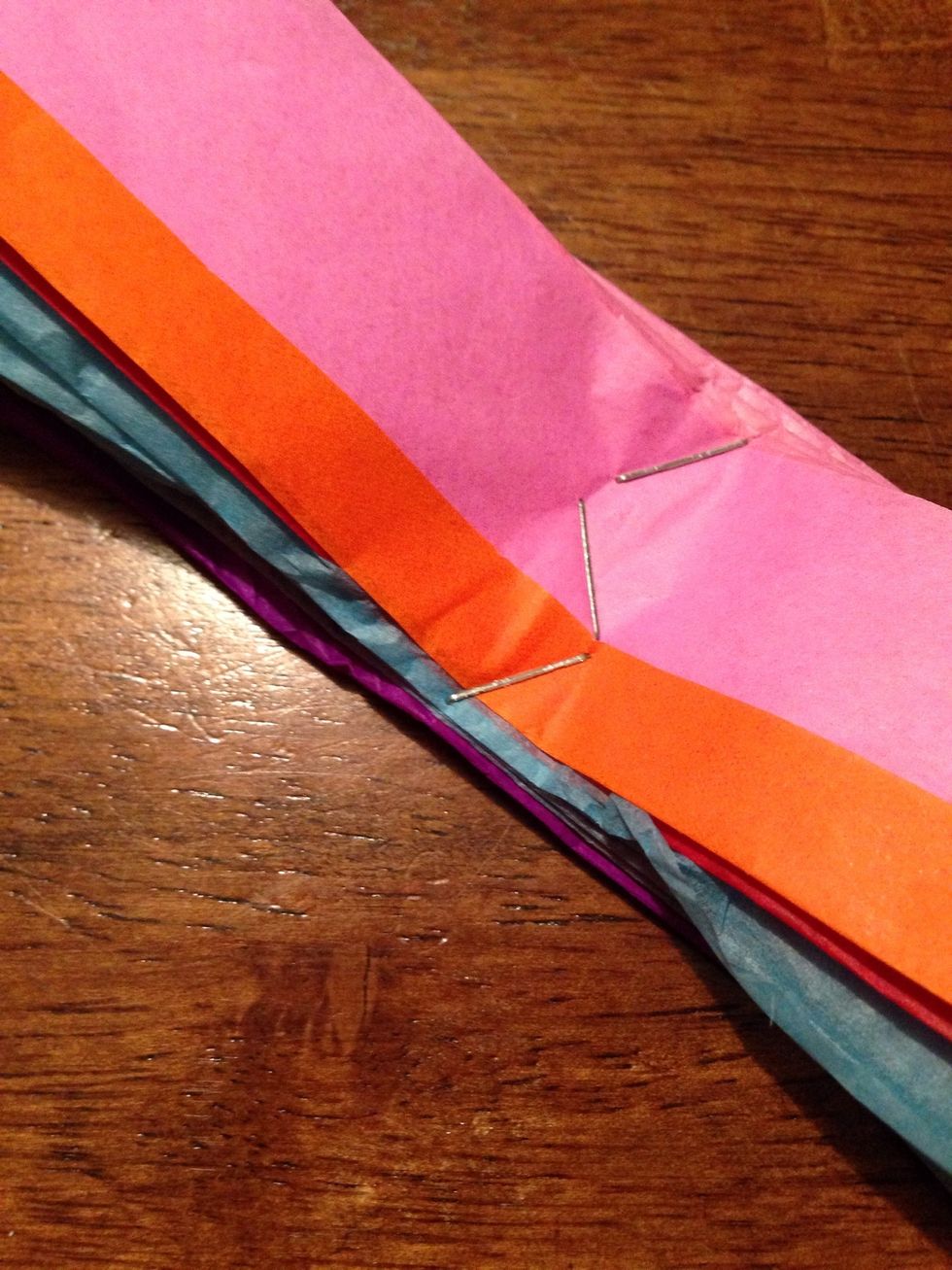 Use wire or staples to hold the center of the flowers.