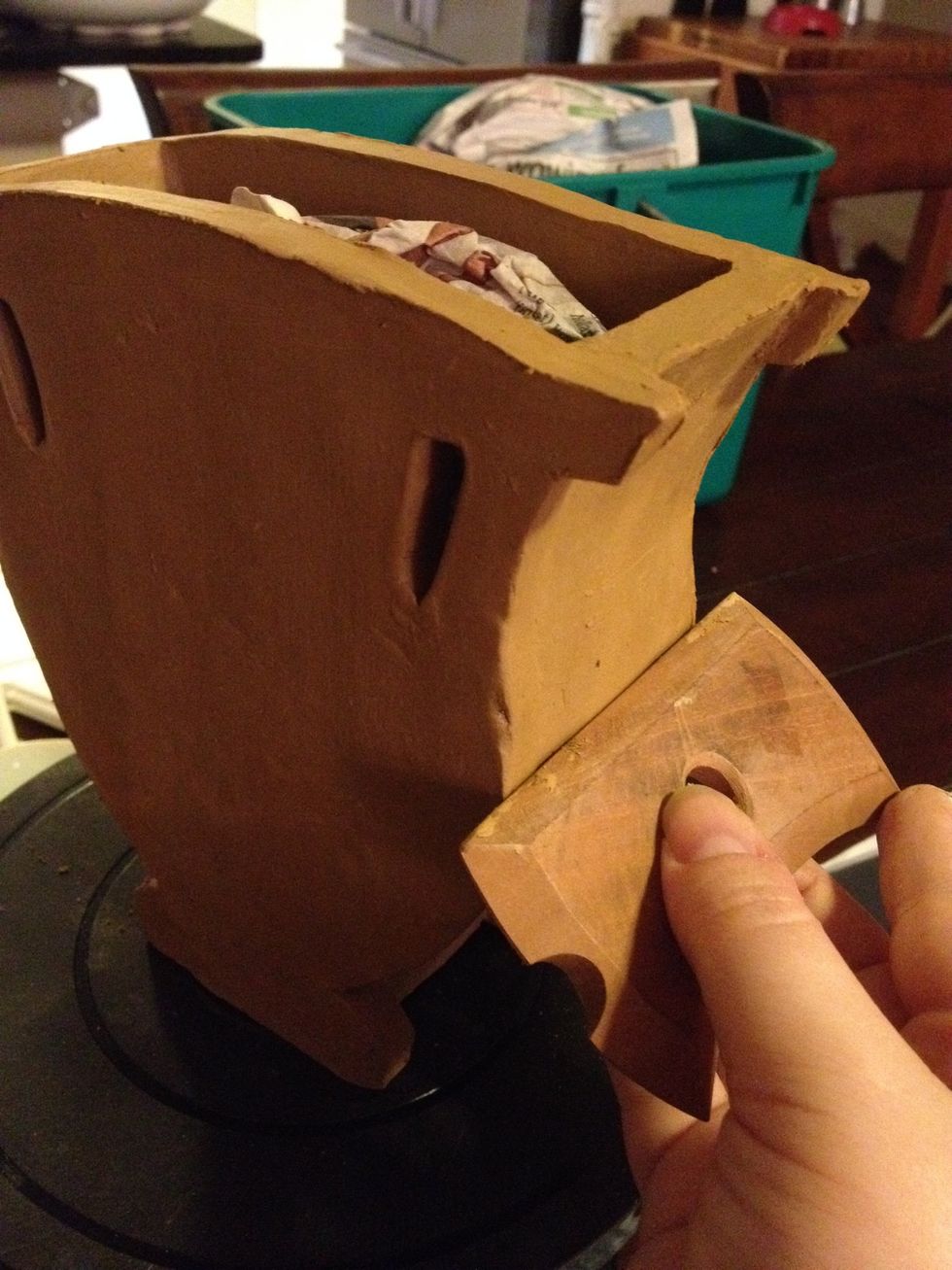 Use wooden clay tools or biscuits (pictured) to further smooth edges and surfaces. You may also burnish at this stage (see Step 17).