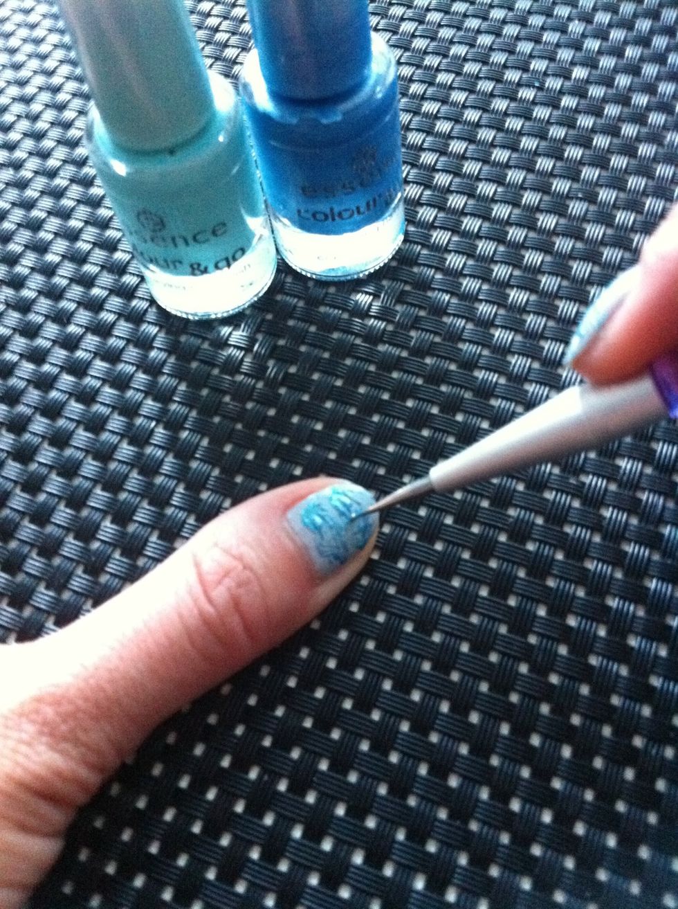 Use your dotter to draw wavy lines over your whole nail. Start from the blobs and draw lines to the other side of your nail.