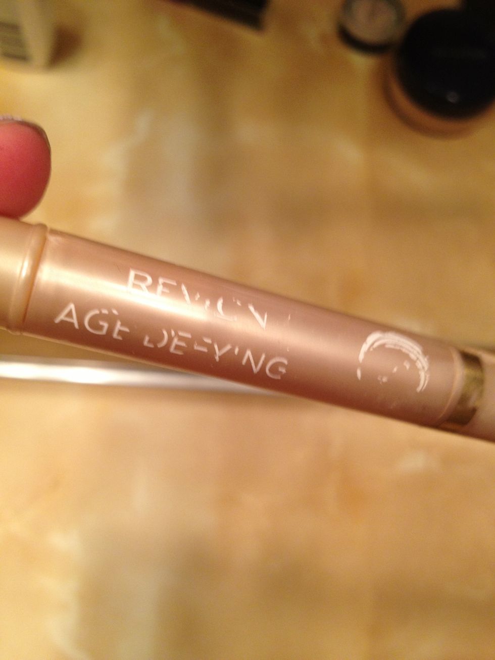 Use your favorite concealer! Put a small dab on your problem spots and pat it into your skin. I use Revlon's Age Defying concealer