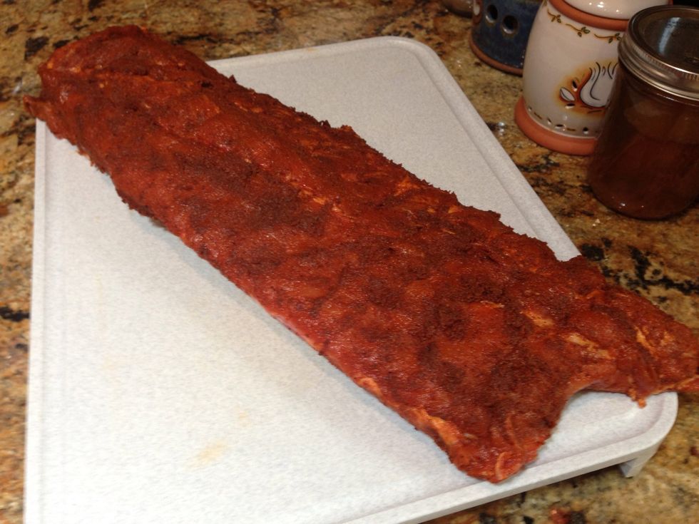 Use your favorite rub to generously season the ribs front and back. Let them sit and "cure" while you prepare your fire\u2026