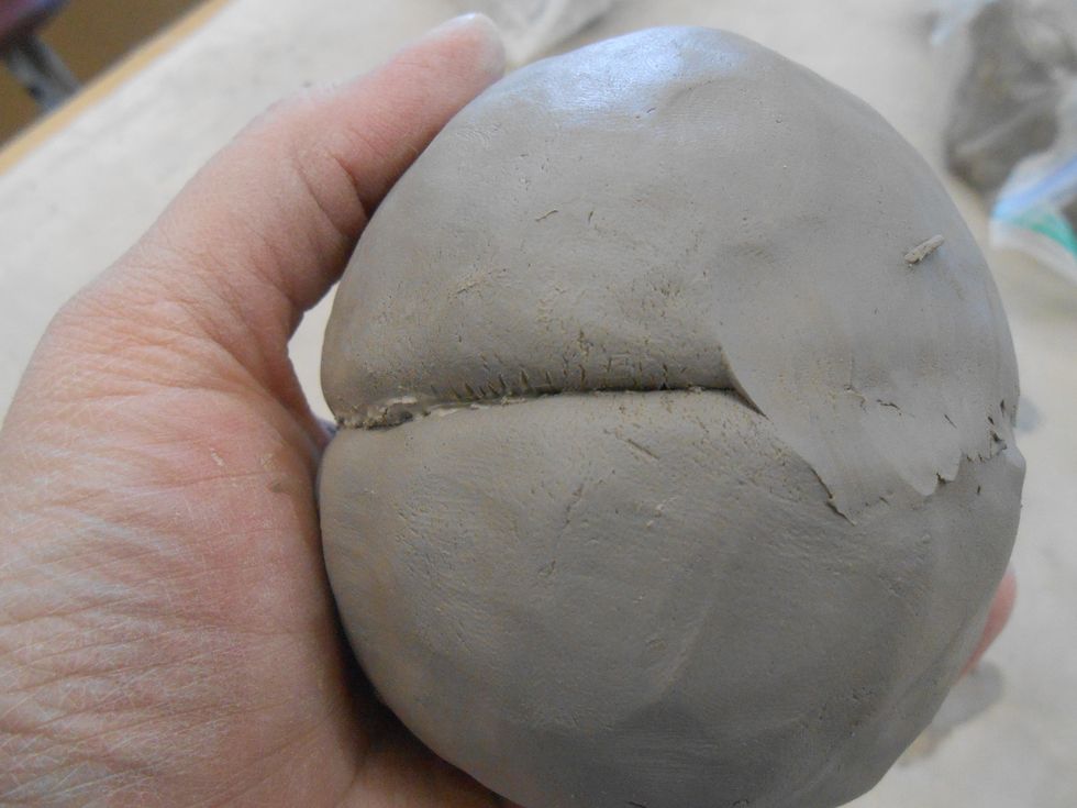 use your finger to lightly smooth two pots together