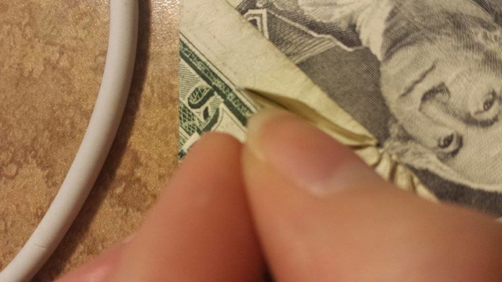 Use your finger to open the long triangle.