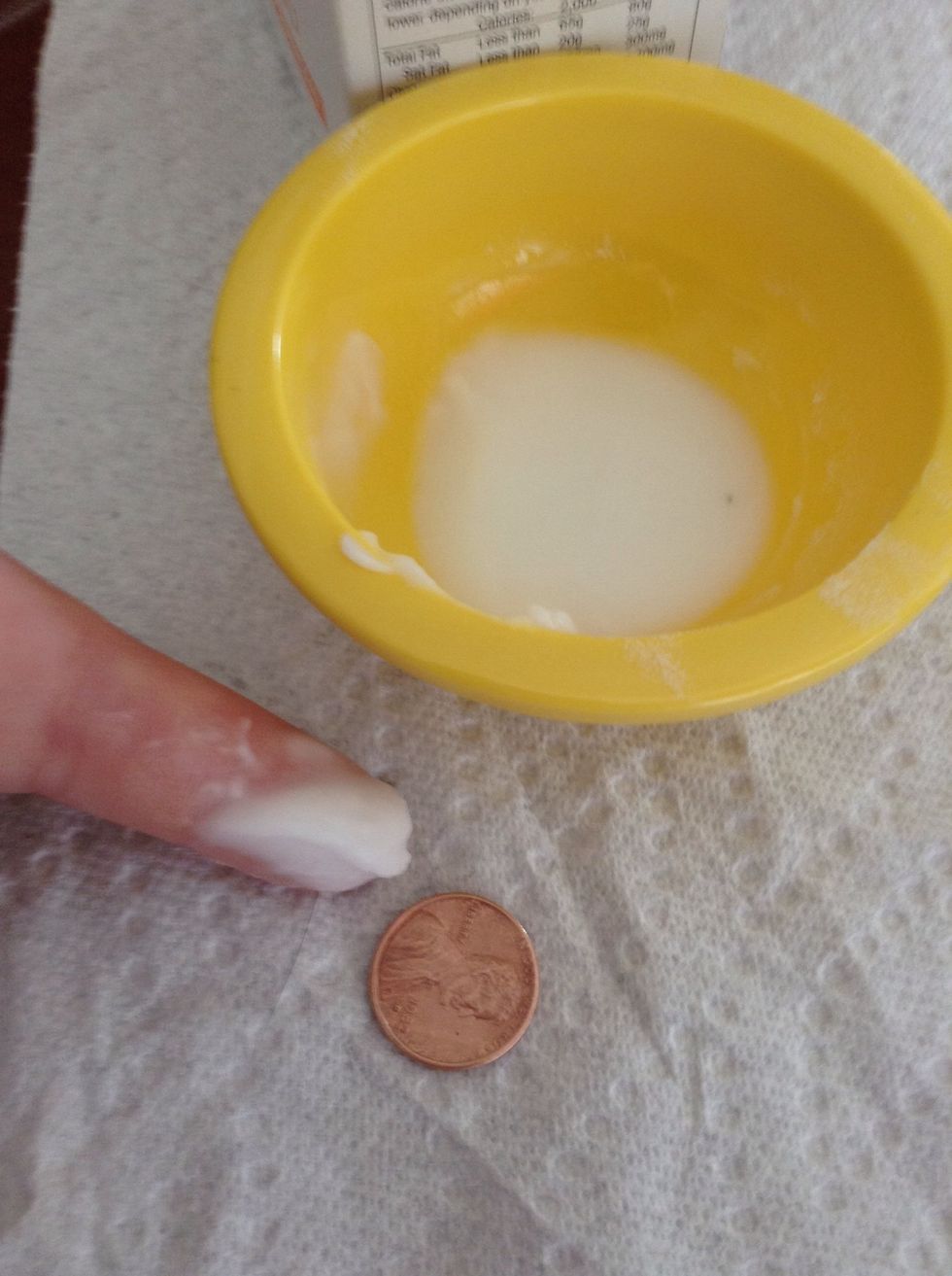 Use your finger to put the second mixture on the penny