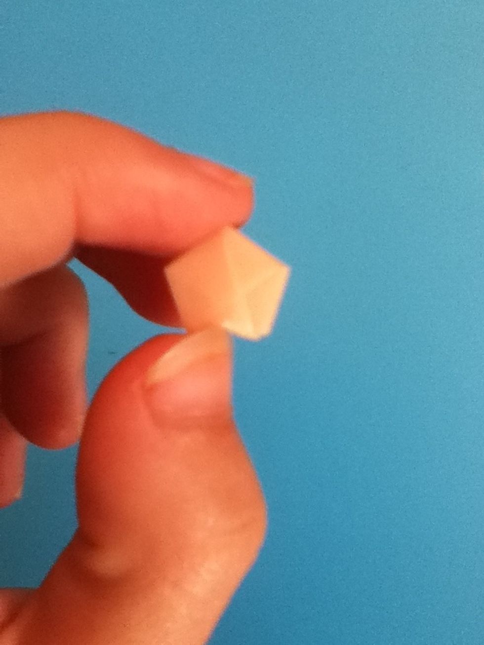 Use your fingernail to gently dent one of the side walls.