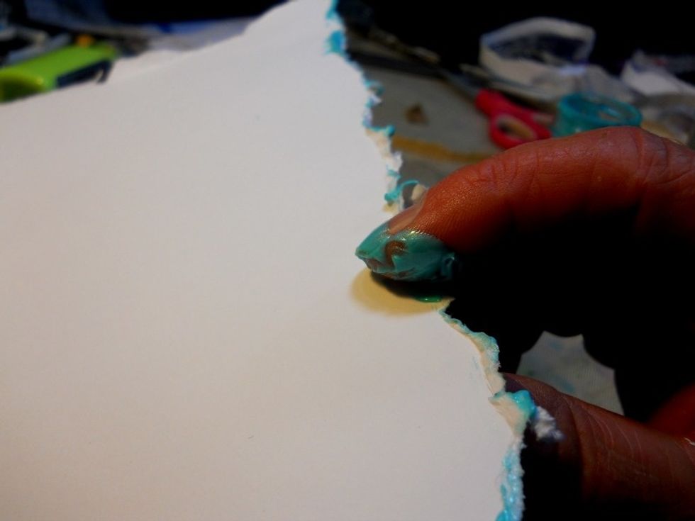 Use your fingers or a sponge to spread Art anthology paint around the edges of the white cardstock.