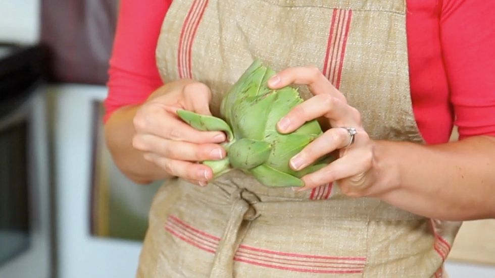 Use your fingers to pull away any torn or bruised outer leaves around the vegetable\u2019s base.