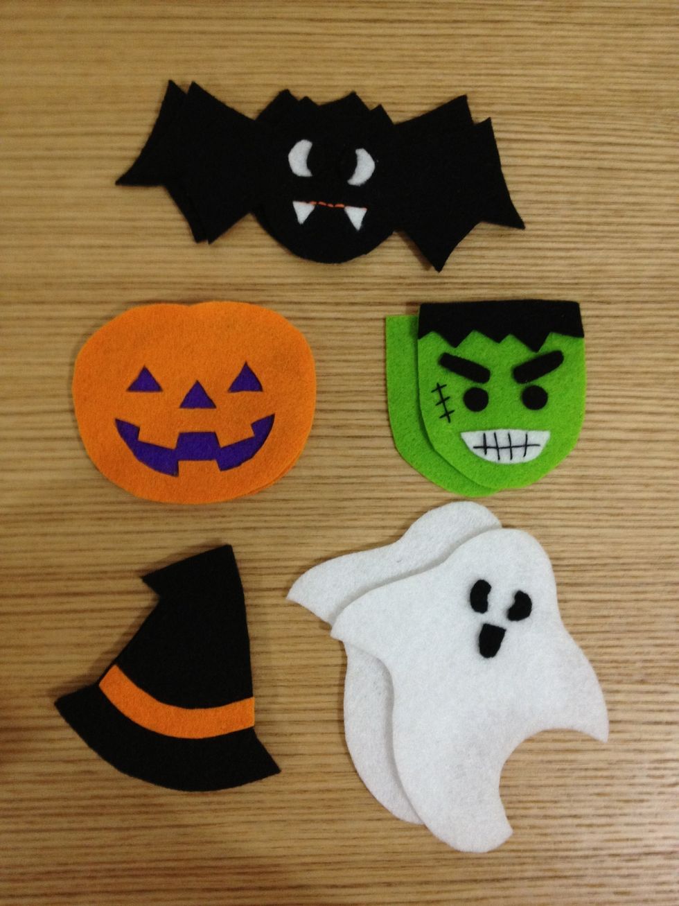 Use your glue for Eyes and teeth of Dr. Bat; purple felt for Lady Pumpkin; eyes ,eyebrows and mouth for Little Frankenstein, eyes and mouth for Mr. Ghost and orange strap for Witch Hat!