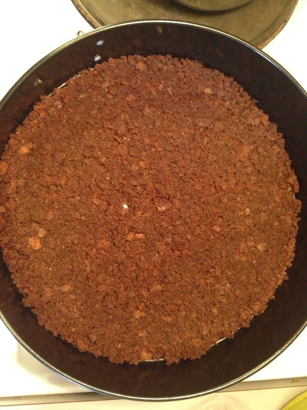 Use your hand or a spoon to spread out the breadcrumbs and butter mix evenly. Then put in the fridge for at least 1 hour.