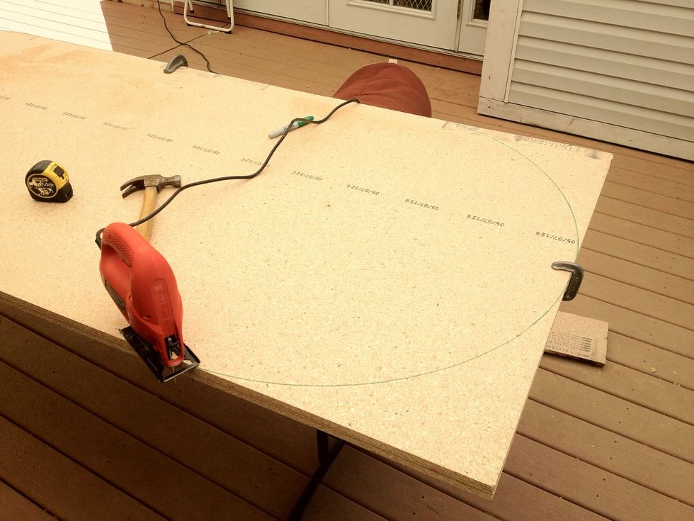 Use your jigsaw to cut along the lines you drew with the string. My jigsaw was $29.99 at Home Depot. I use clamps to keep the lumber aligned perfectly. This is important. Clamps are inexpensive!