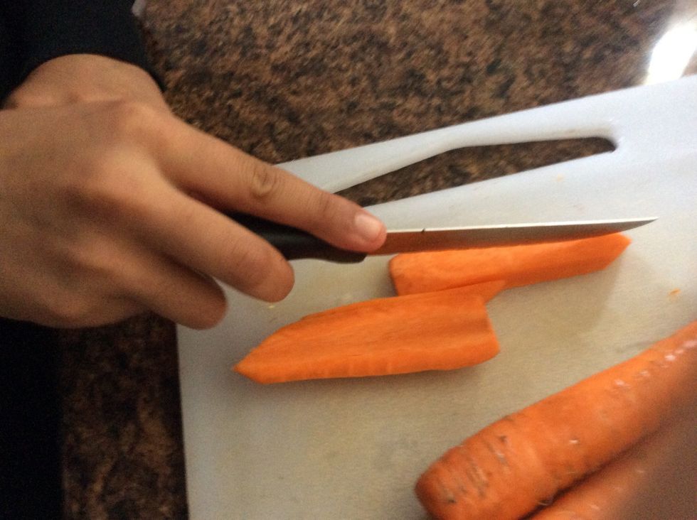 Use your knife and cutting board to cut the carrots into strips. NOTE: make sure they are not to thin and be careful when using sharp objects.