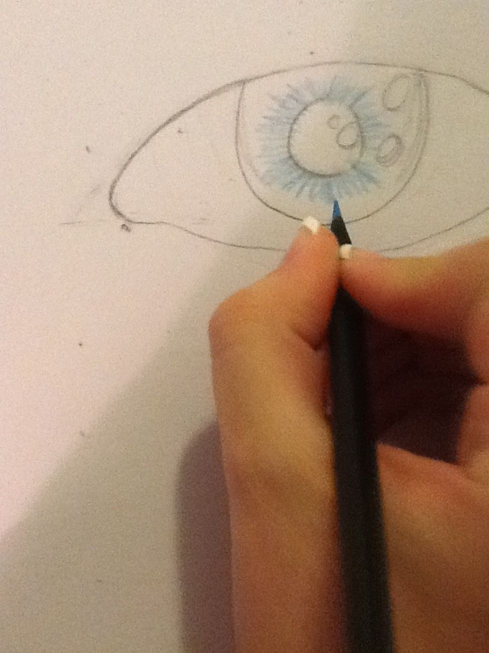Use your lightest color (not white) nearest to the pupil