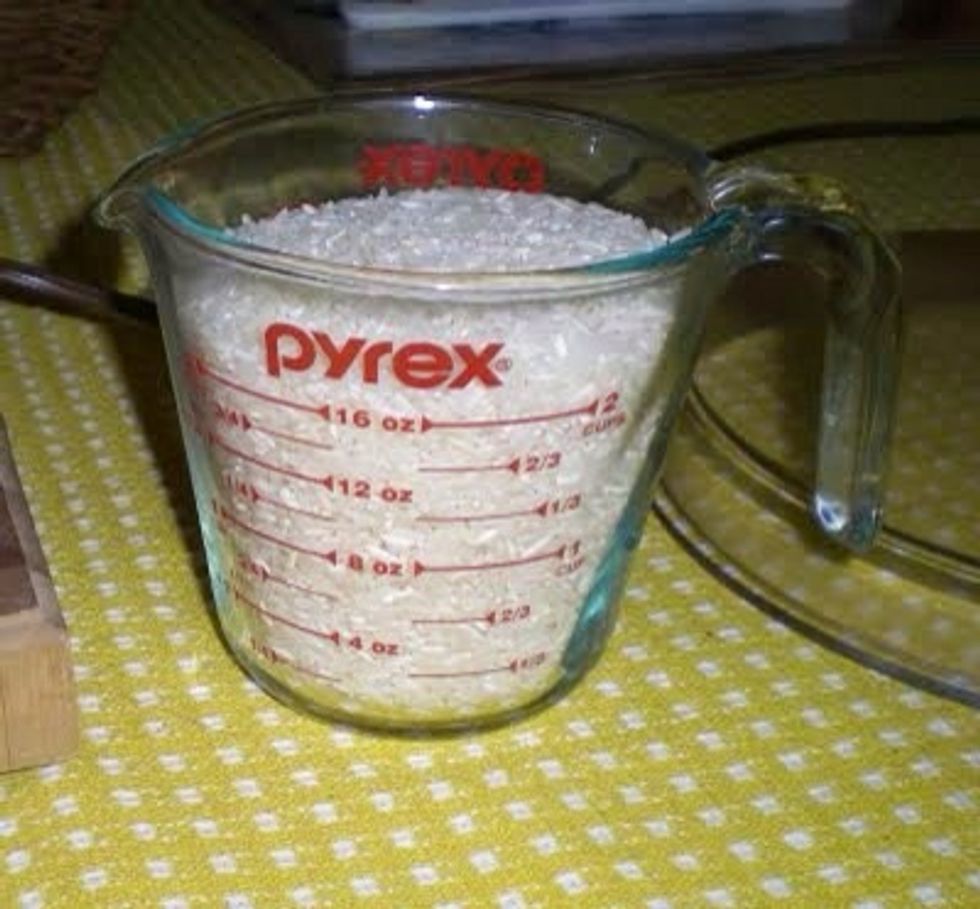 Use your measuring cup to get an exact measurement of two cups of uncooked rice.    http://wwwjarvishouse.blogspot.com/2009/12/fennel-rice-finocchio-rice.html