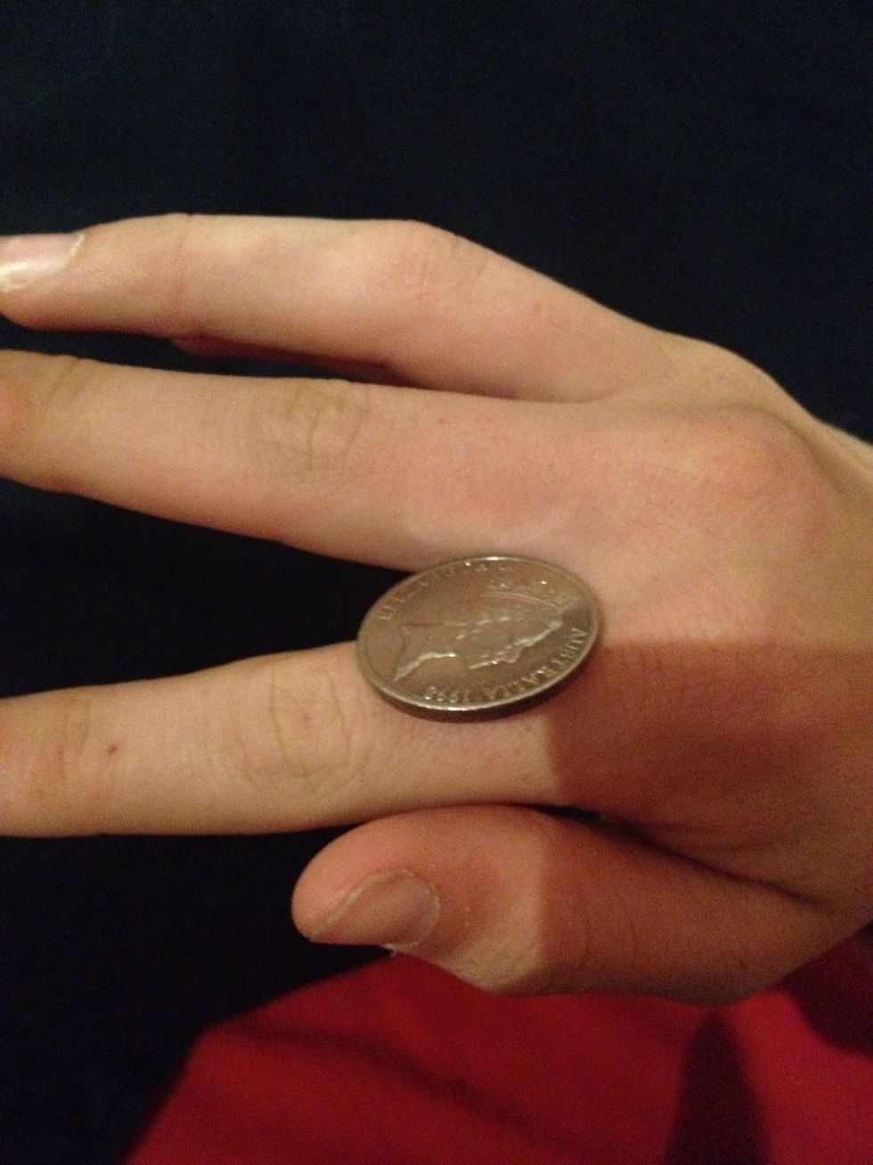 Use your middle finger the lever the coin up