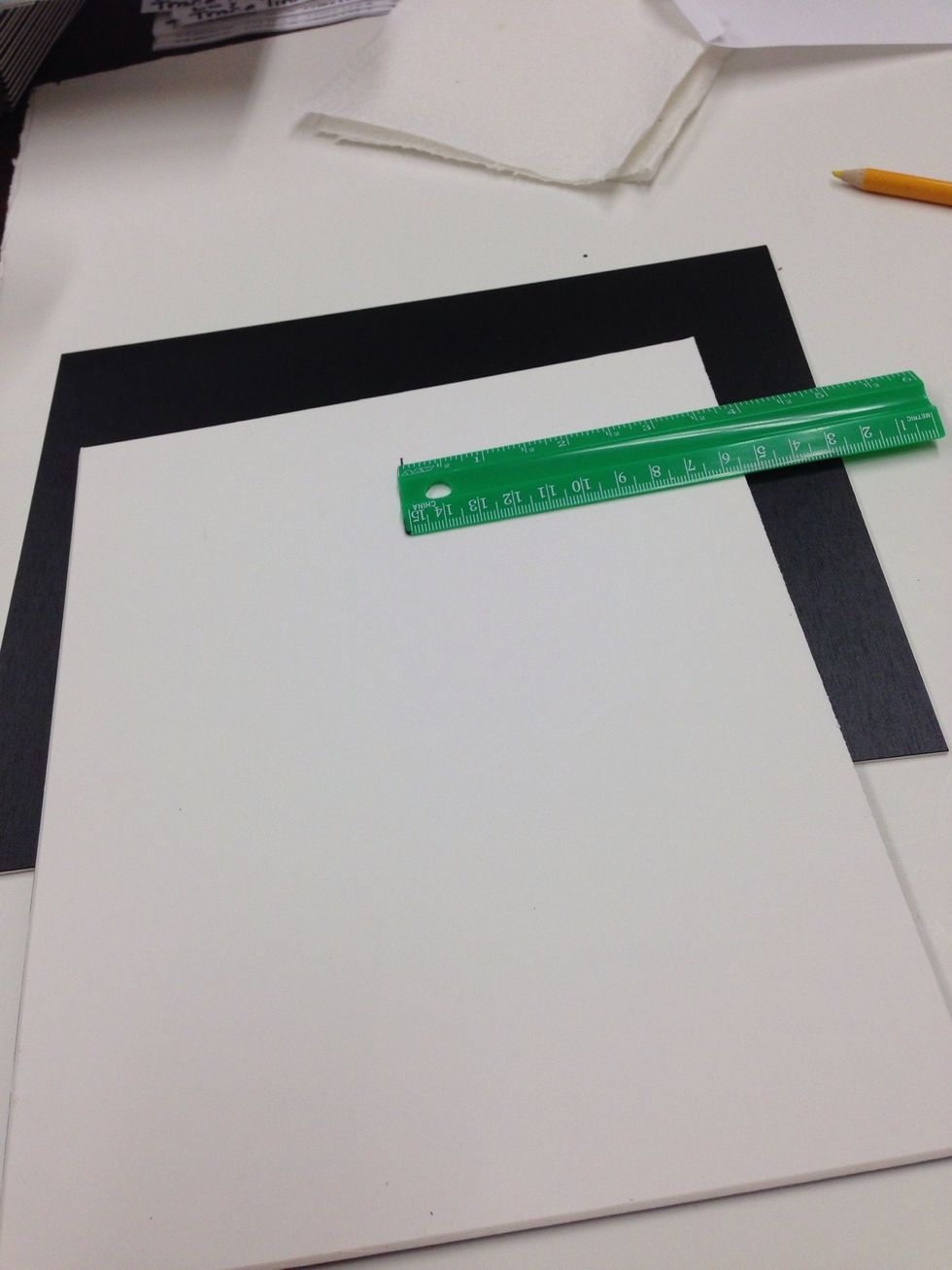 Use your ruler to make a small line along the top center edge of your picture on the backside.