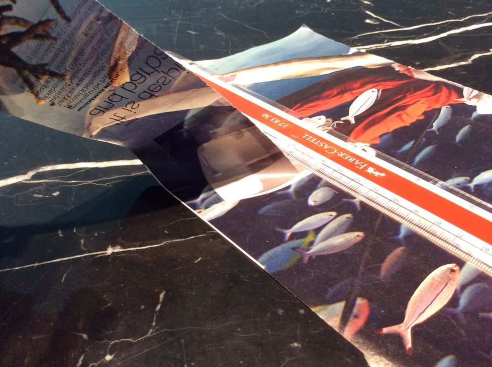 Use your ruler to tear them into the 2 inch strips that you want. Do that for all your pages, I used about 80 ( i think ) sheets of magazine paper, by the way. Which made quite a lot.