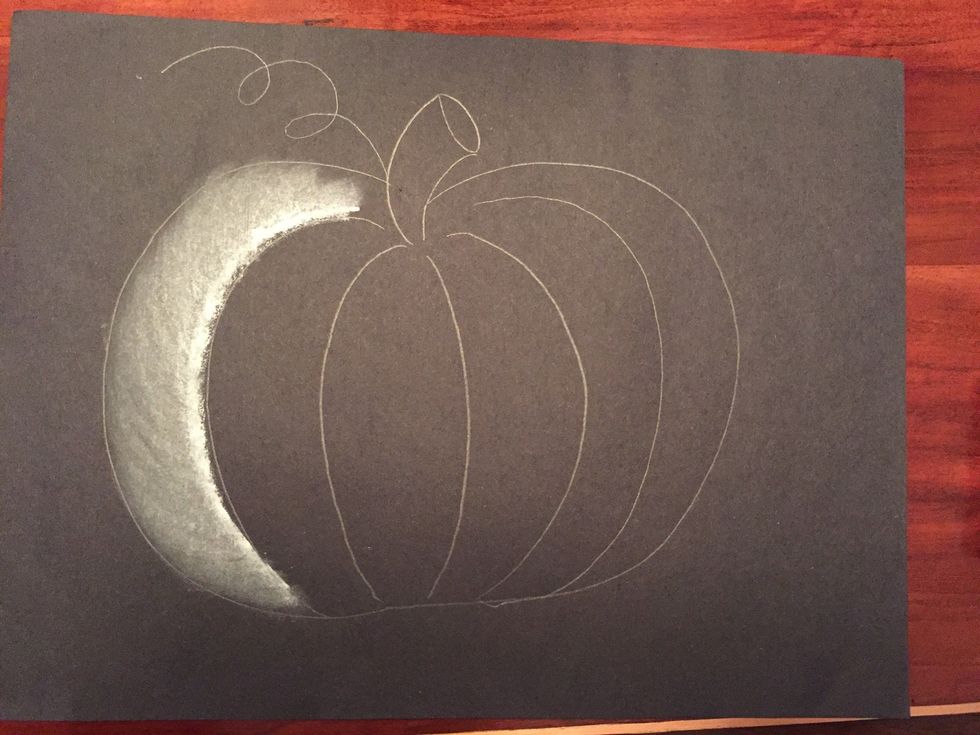 Use your tissue to blend the white to the left. Leave some black.