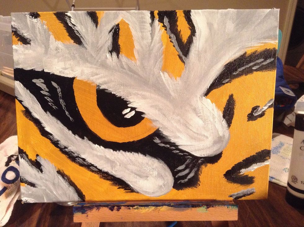 Use your white to add an accent to the pupil and to add depth to the black areas.