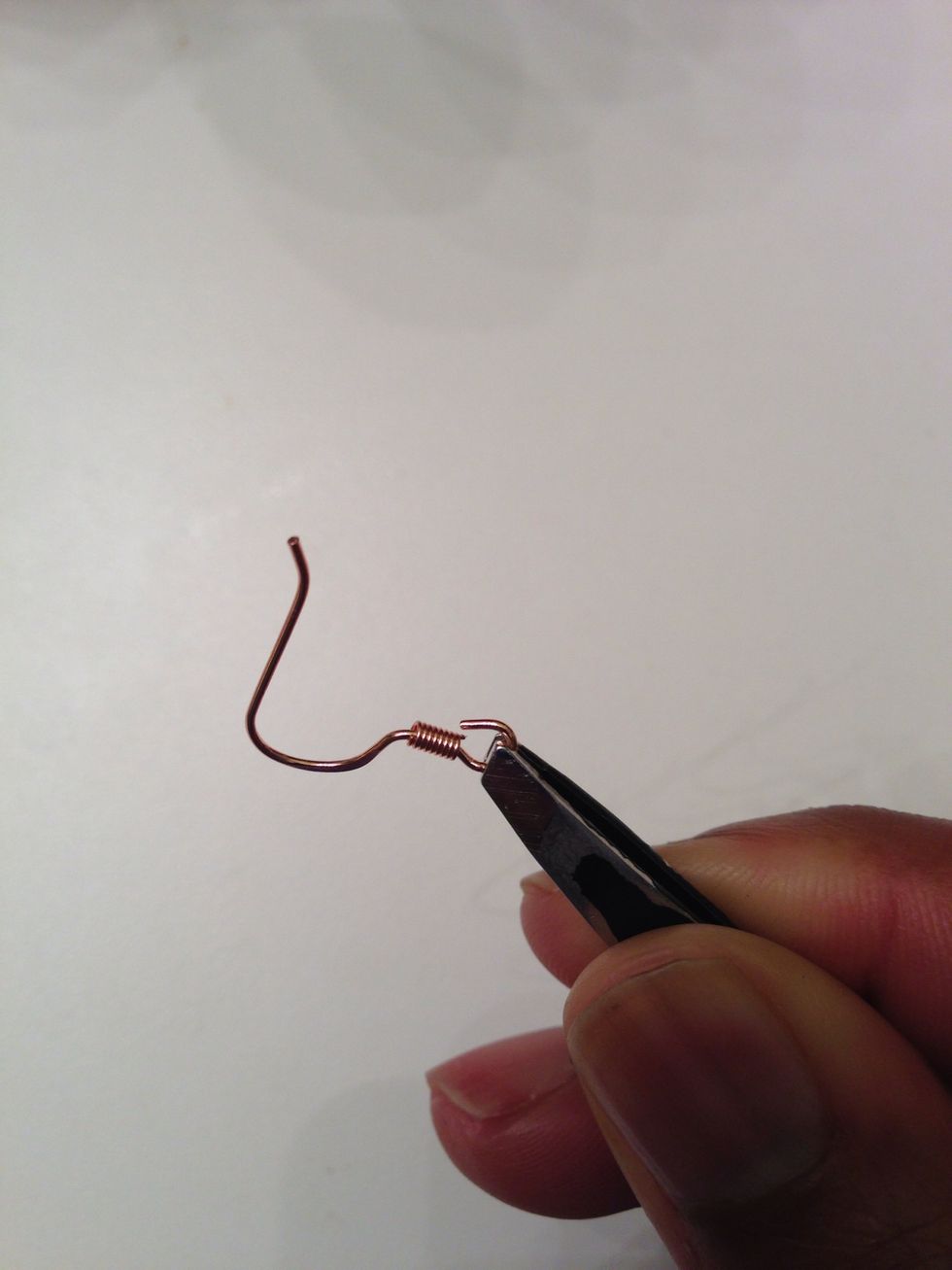 Used my tweezers to gently bend the loop on the ear wire open.
