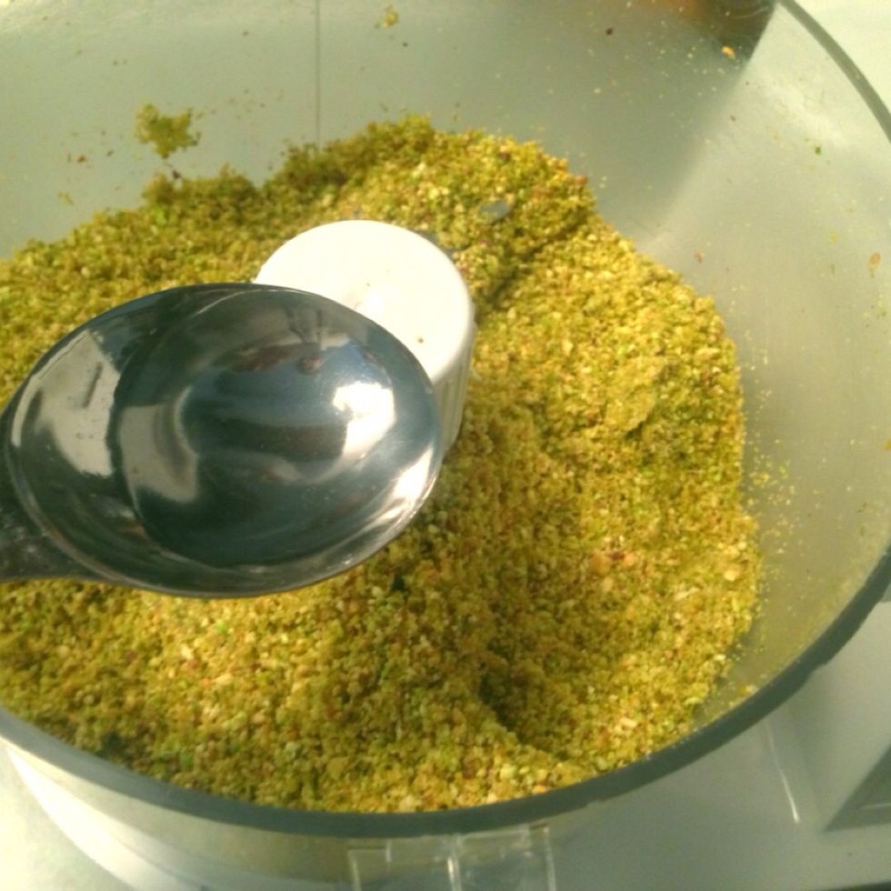 Using 1 to 4 tablespoons at a time, add water and continue blending. It's best to slowly add water and blend to reach your desired consistency, one that is not to watery.