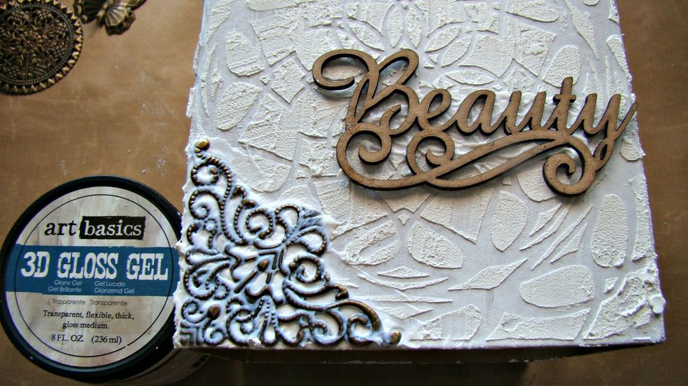 Using 3D Gel Paste I adhered my embellishments, flowers and wood pieces to my box. Allow to dry.