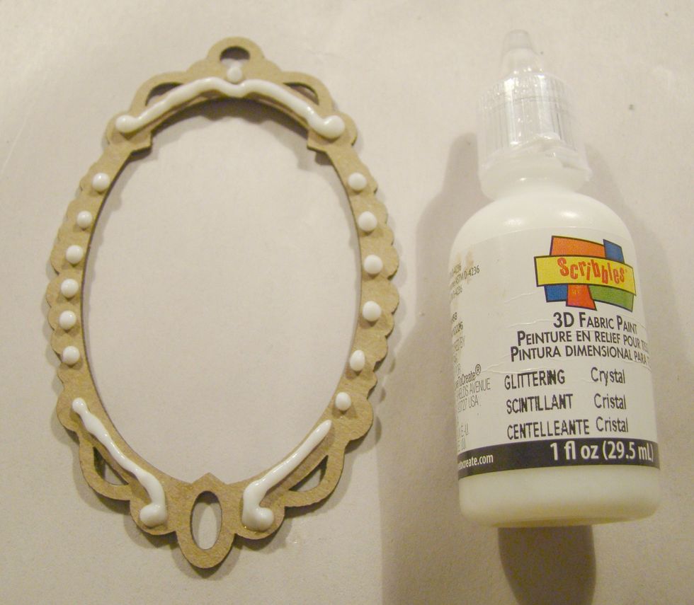 Using 3D paint, decorate your chipboard frame and allow to dry completely.