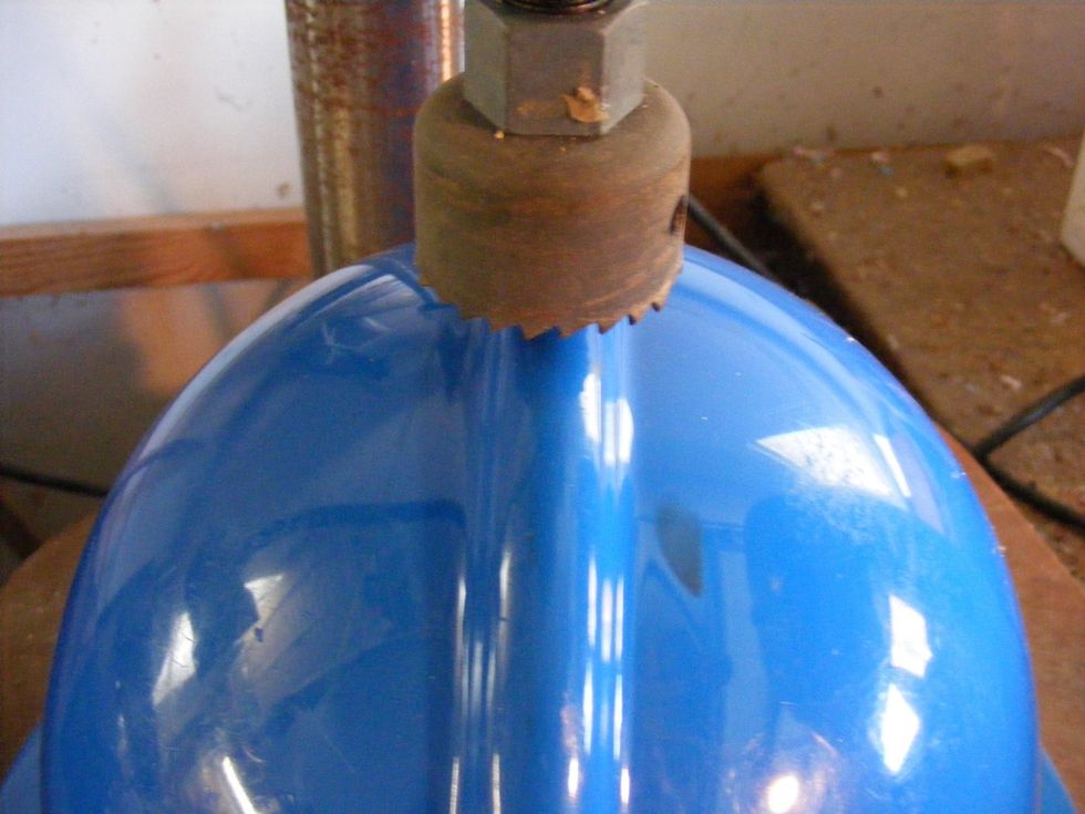 Using a 1.5 hole-saw, I bored a hole in the center (or top) of the hard hat.