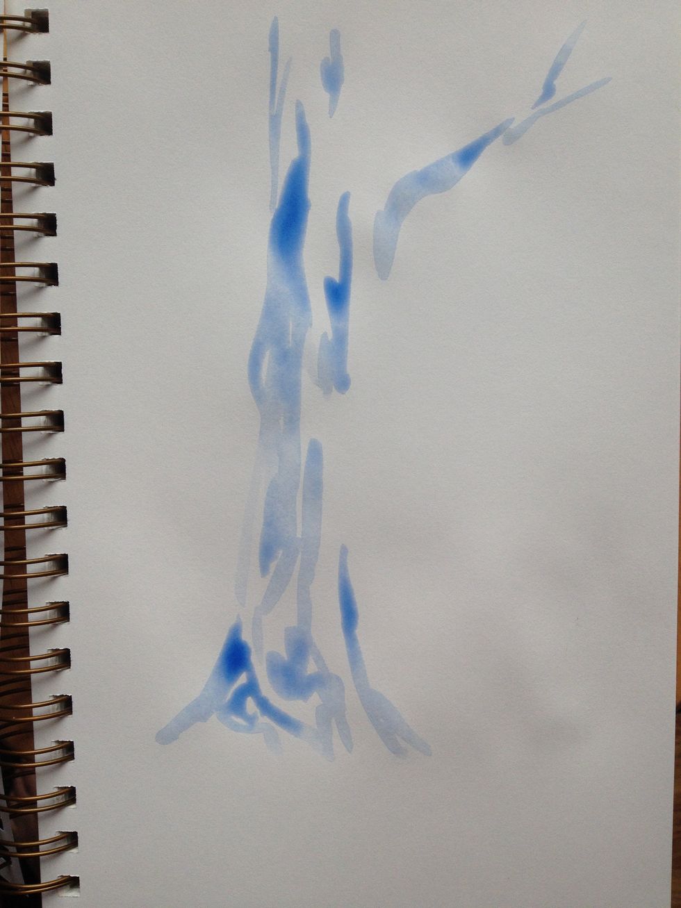 Using a 30% mixture of Ultramarine blue, begin drawing out your tree. Notice that there is no outline. Areas are defined by both large and small strokes, the white of the paper is used to show light.
