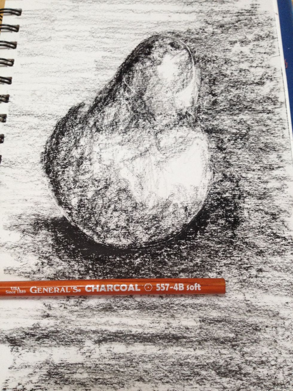 Using a 4B pencil, I added transitions from the darker background to the lighter and the mid-tones of the sphere. The 4B naturally makes lighter marks than the square charcoal. Still no outlines!