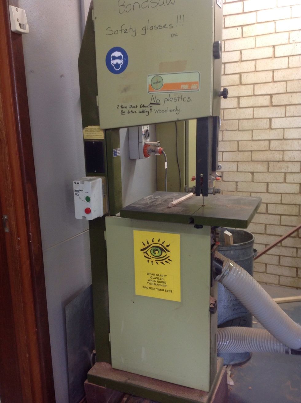 Using a Band Saw cut one side on your board. Don't forget to wear safety glasses at all times