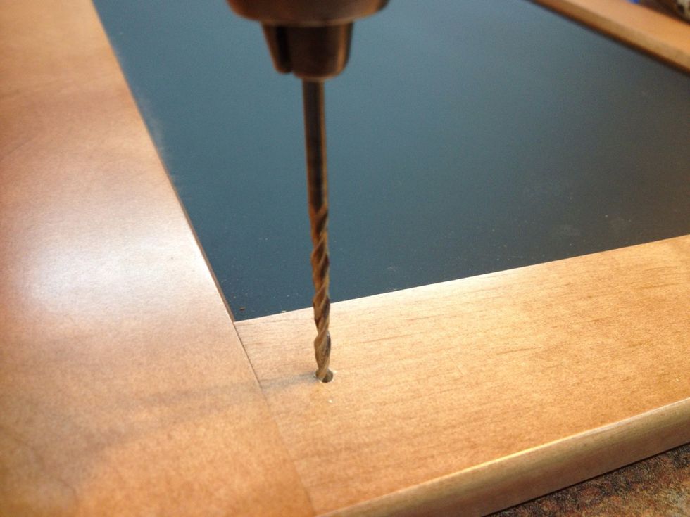 Using a bit just smaller than the diameter of the screw, predrill your holes for the hooks, then screw them onto the frame. Install desired hanging hardware (sawtooth hangers are not recommended).