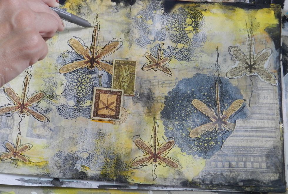 Using a black pen, you should freely trace the outline of dragonflies.