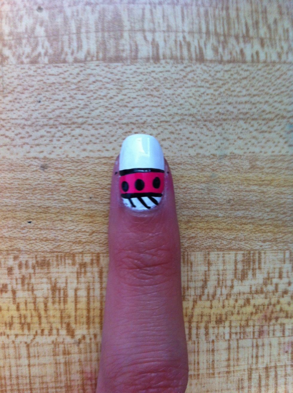 Using a black striper, outline the hot pink you've just made and create diagonal lines on top.