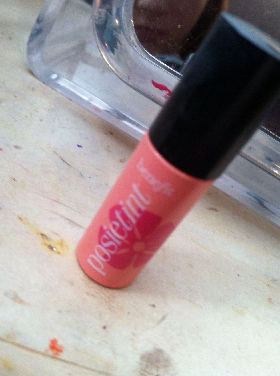 Using a blush (cream stain or powder), apply to the apples of your cheeks and blend upwards to your temples