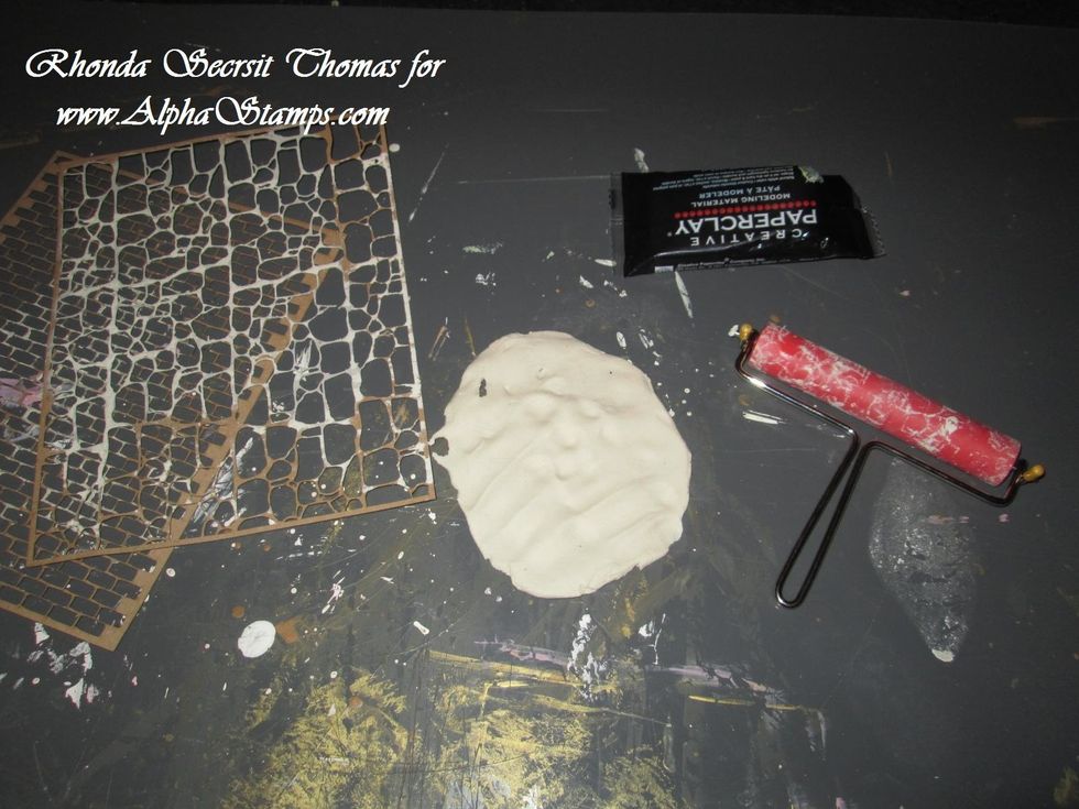 Using a Brayer, roll out a thin yet sturdy layer of Creative Paperclay.