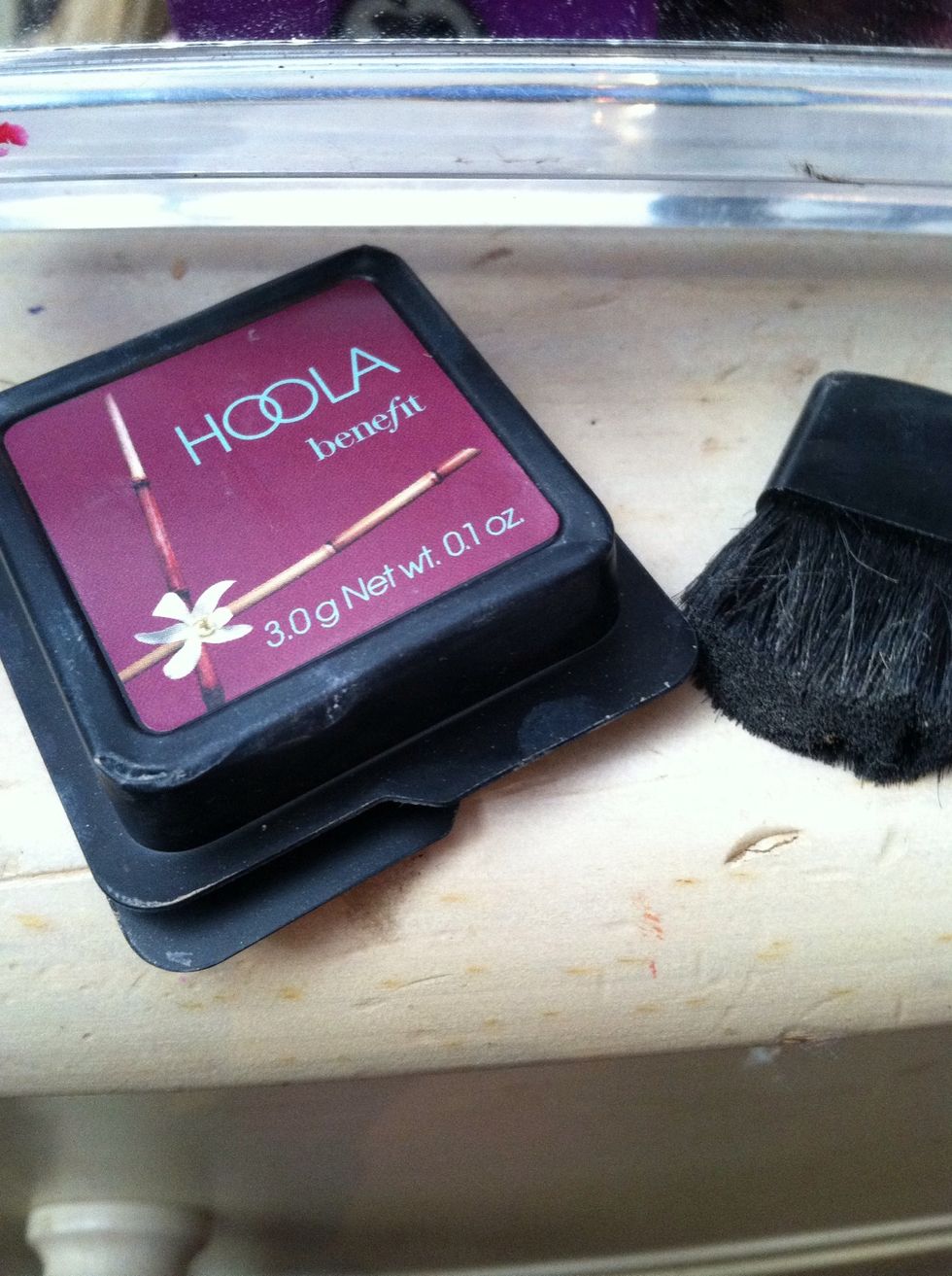 Using a bronzer on a brush like this, apply to the hollows of your cheek bones, the sides of your nose and your temples to contour