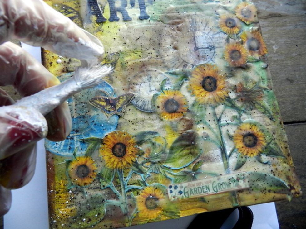 Using a brush, splash brown acrylic paint.