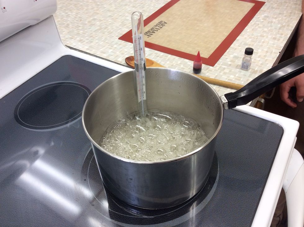 Using a candy thermometer or digital temperature gun ($25 on Amazon) bring the water, corn syrup, and sugar to 295 degrees F.