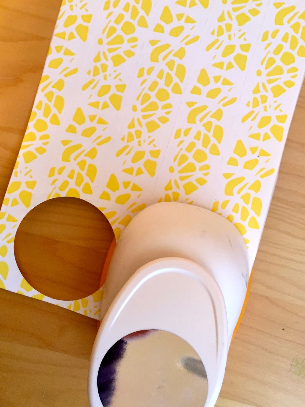 Using a circle punch or cutting by hand with a template, make as many circles as you can from the one sheet of paper.