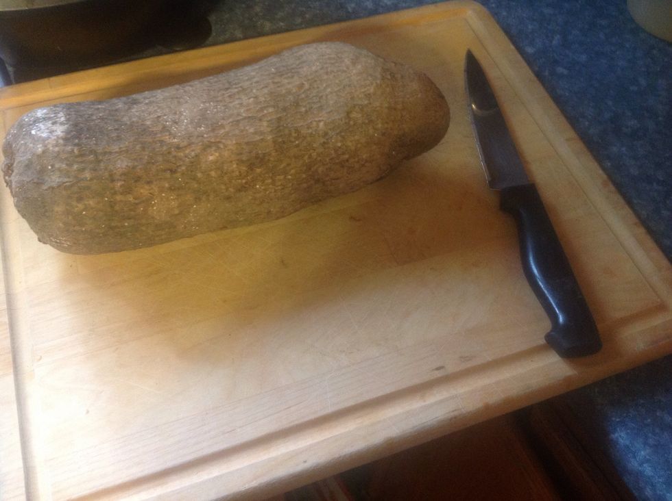 Using a cutting board and sharp knife cut up your African yam, be sure you have the African yam and not Cocoa yam or other. These are long and tubular in shape.